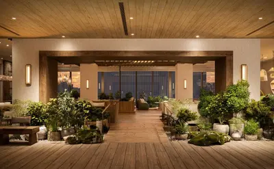 a lobby with potted plants in a building at 1 Hotel Tokyo in Tokyo