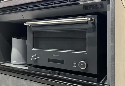 a black toaster oven sitting in a microwave at Tokyo Waseda Base in Tokyo