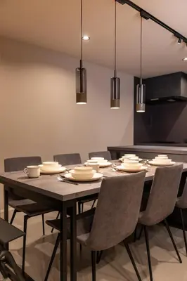 a dining room with a black table and chairs at Tokyo Waseda Base in Tokyo