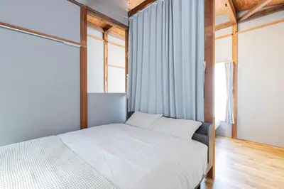 a bedroom with a white bed and a window at \u9418\u30f6\u6df5Stay in Tokyo