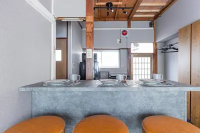 a kitchen with a counter with three plates on it at \u9418\u30f6\u6df5Stay in Tokyo