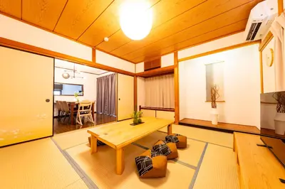 a living room with a wooden ceiling at Haleluana SHIBAMATA in Tokyo