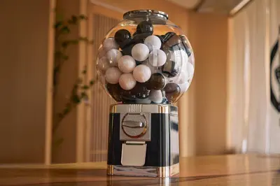 a vase filled with balls sitting on top of a coffee maker at Tsubomi Shibuya in Tokyo
