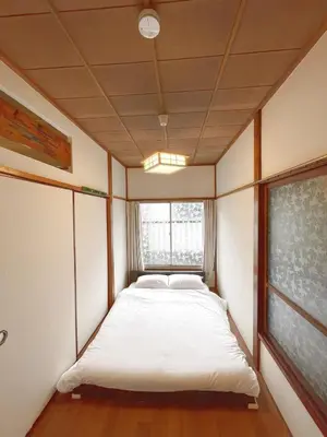 a small bed in a room with a window at Ymn\u5c0f\u83c52\u4e01\u76ee in Tokyo