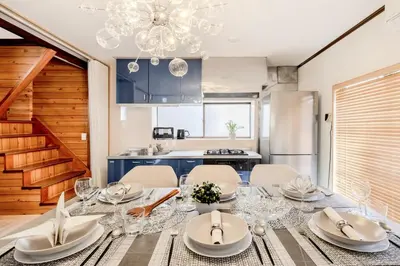a kitchen and dining room with a table and chairs at Kasai Cozy House in Tokyo