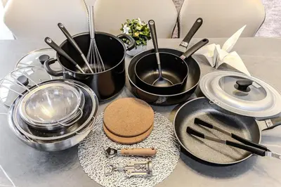 a bunch of pans and utensils on a table at Kasai Cozy House in Tokyo