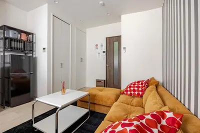 a living room with a couch and a table at sMS\u8db3\u7acb2\u4e01\u76ee in Tokyo