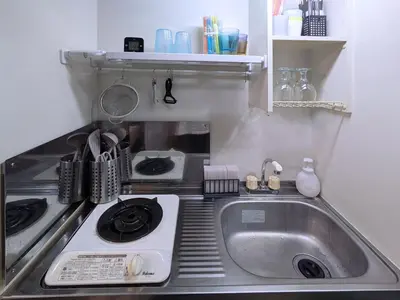 a kitchen with a sink and a stove at Near Shibuya Station Dogenzaka 3Beds Travel Work in Tokyo
