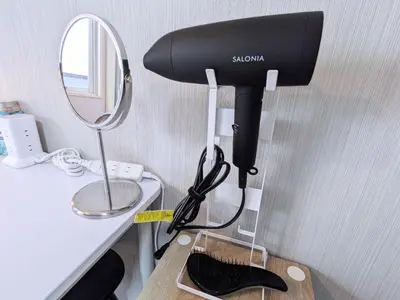 a hair dryer sitting on a counter next to a mirror at Near Shibuya Station Dogenzaka 3Beds Travel Work in Tokyo