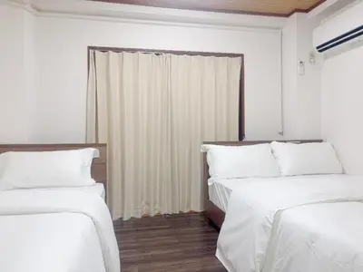 a room with two beds and a window at 3F 3 minutes walk from Nishi-Oi Station, Shinagawa Ward, 4 stations available, surrounded by commercial streets, rich life, convenient transportation in Tokyo