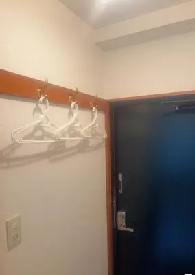 a room with a door and a hanger with hooks at 3F 3 minutes walk from Nishi-Oi Station, Shinagawa Ward, 4 stations available, surrounded by commercial streets, rich life, convenient transportation in Tokyo