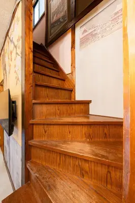 a set of stairs in a room with wooden floors at EDO GATEI Sakura Biyori Stay in Tokyo