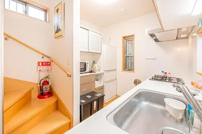a kitchen with a large tub in a tiny house at Anzu 4 Bed rooms Villa 5 minutes walk from Keise line Edogawa station in Tokyo