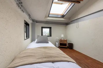 a bedroom with a large bed with a skylight at Funabori in Tokyo