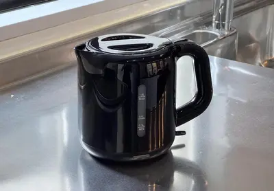 a black coffee pot sitting on a kitchen counter at Funabori in Tokyo
