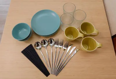 a table with forks and plates and utensils at Solaria Tokiwa by Tranova in Tokyo