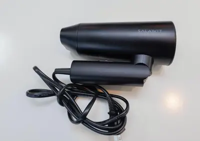 a black flashlight with a cord on a table at Solaria Tokiwa by Tranova in Tokyo