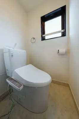 a bathroom with a white toilet with a window at Solaria Tokiwa by Tranova in Tokyo