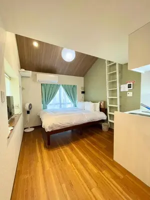 a bedroom with a bed with a window in it at fukuhana \u6771\u65b0\u5bbf C8 in Tokyo