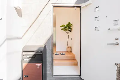 a door leading into a hallway with a dishwasher at Mori house \u65b0\u5c0f\u5ca9B in Tokyo