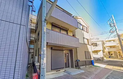 an apartment building with a gate on the side of it at 3 Story Private House, 7 Min Walk to Yamanote Line Direct to Shinjuku, Ikebukuro, Shibuya in Tokyo