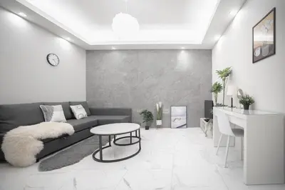 a living room with a couch and a table at Brand New Luxury Suite 7 min to Omotesando 2 min to Shibuya in Tokyo