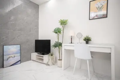 a white living room with a tv and a desk at Brand New Luxury Suite 7 min to Omotesando 2 min to Shibuya in Tokyo