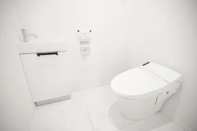 a white bathroom with a toilet and a sink at Brand New Luxury Suite 7 min to Omotesando 2 min to Shibuya in Tokyo