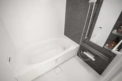 a white bathroom with a tub and a sink at Brand New Luxury Suite 7 min to Omotesando 2 min to Shibuya in Tokyo