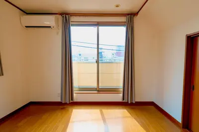 an empty room with a large window and wooden floors at Shinjuku Y HOTEL II 1 minute to 7-Eleven 6DK 2 bathrooms in Tokyo