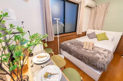 a small room with a bed and a table at iroha in Tokyo