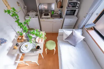 a small living room with a couch and a table at iroha in Tokyo