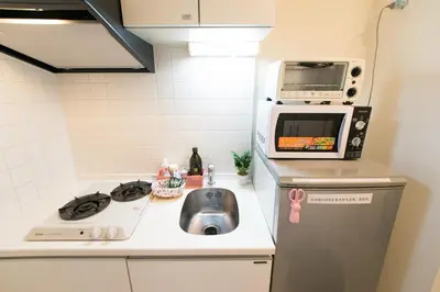 a small kitchen with a sink and a microwave at 901 5mins from JR Kinshicho! Near Asakusa&Skytree! in Tokyo
