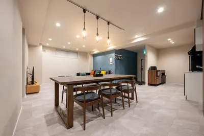 a kitchen and dining room with a table and chairs at Sharil Shiina-machi in Tokyo