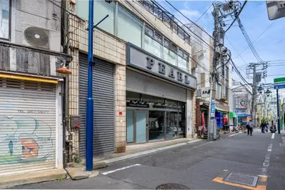an empty street in a city with a store at Sharil Shiina-machi in Tokyo