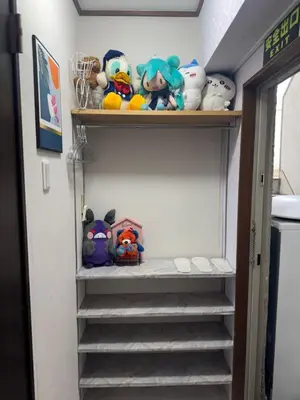 a bunch of stuffed animals on stairs in a room at \u548c\u98a82\u897f\u5317\u53e3 in Tokyo