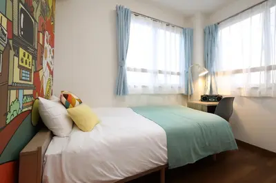 a bedroom with a bed and a window at Stay Master Hotel in Tokyo