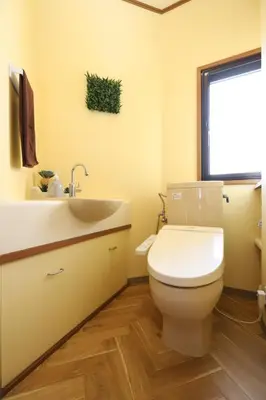 a bathroom with a toilet and a sink and a window at Stay Master Hotel in Tokyo