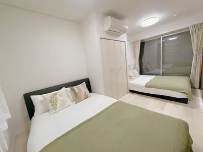 a bedroom with two beds in a room at Sakura Stay \u5343\u99c4\u6728 in Tokyo