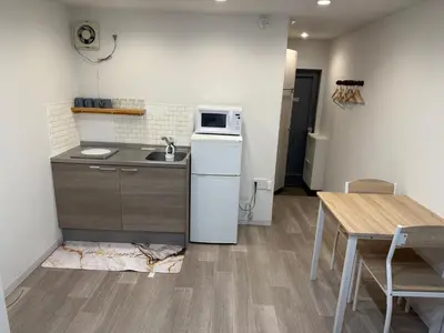 a small kitchen with a sink and a refrigerator at 5minutes from Shinjuku Shin-Okubo Station-k203 in Tokyo