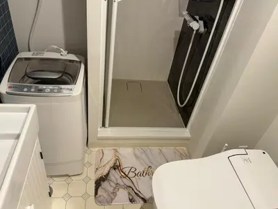 a small bathroom with a shower and a toilet at 5minutes from Shinjuku Shin-Okubo Station-k203 in Tokyo