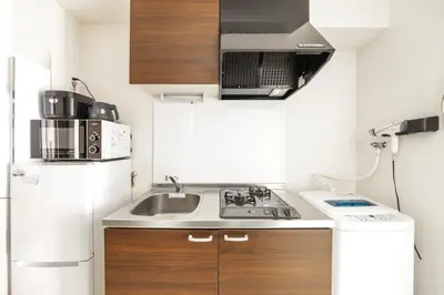 a small kitchen with a sink and a refrigerator at \u677f\u6a4b\u533a yuga house\u99c5\u8fd1102 in Tokyo