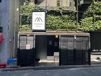 a building with a monday lunch sign on it at Meguro Midori Hotel in Tokyo