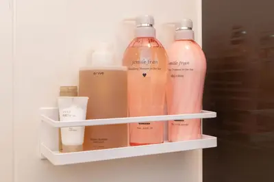 a shelf with four bottles of soap and moisturizers at Hotel-Like Simmons Bed Couple Disney Shinjuku in Tokyo
