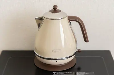 a white tea kettle sitting on top of a table at Hotel-Like Simmons Bed Couple Disney Shinjuku in Tokyo