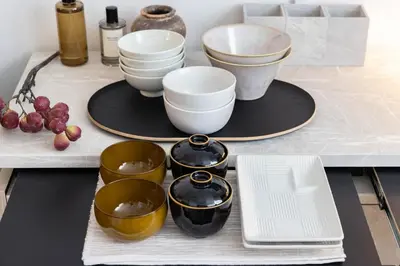 a table with bowls and plates on top of it at Hotel-Like Simmons Bed Couple Disney Shinjuku in Tokyo