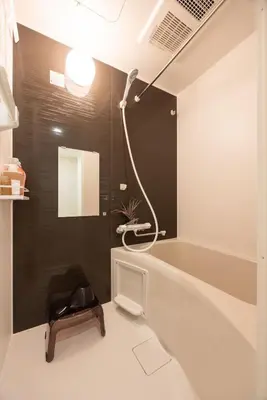 a bathroom with a shower and a bath tub at Hotel-Like Simmons Bed Couple Disney Shinjuku in Tokyo