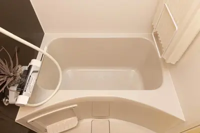 a white toilet in a bathroom with a sink at Hotel-Like Simmons Bed Couple Disney Shinjuku in Tokyo