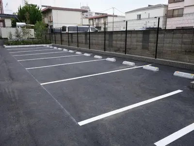 a parking lot with white lines on it at Premium hotel MONday MAIHAMA View 1 in Tokyo