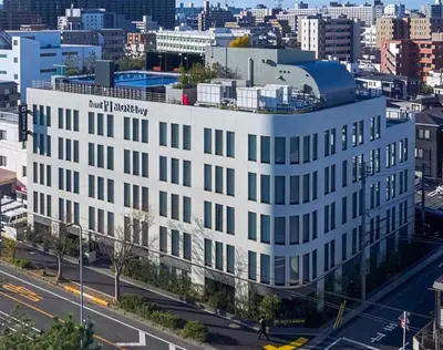 an aerial view of a white building at Premium hotel MONday MAIHAMA View 1 in Tokyo